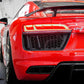 Red Audi R8 sports car with a visible badge in a showroom setting