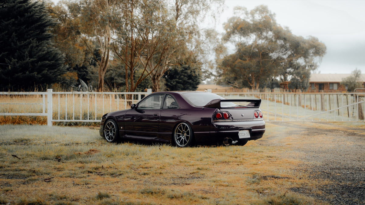 SWF01 forged wheels in Shadow Black Chrome on a purple Nissan Skyline R33, side profile