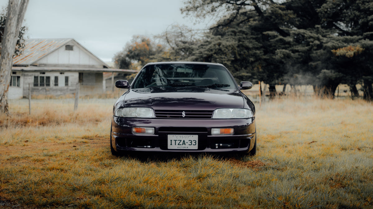 SWF01 forged wheels in Shadow Black Chrome on a purple Nissan Skyline R33, front view