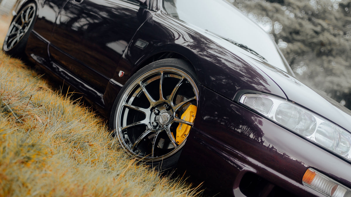 SWF01 forged wheels in Shadow Black Chrome on a purple Nissan Skyline R33, front wheel, low angle