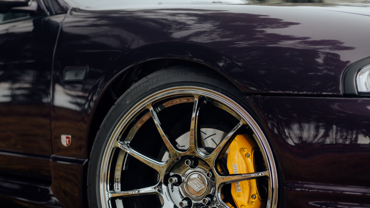 SWF01 forged wheels in Shadow Black Chrome on a purple Nissan Skyline R33, front wheel and Brembo caliper