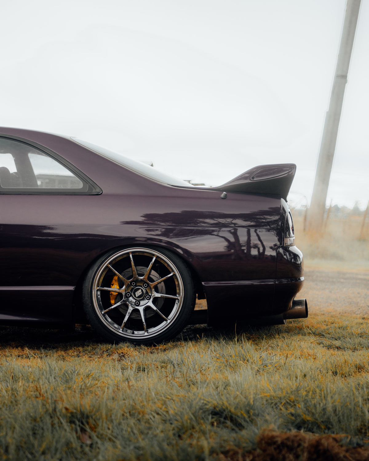 SWF01 forged wheels in Shadow Black Chrome on a purple Nissan Skyline R33, rear three-quarter
