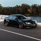 SWF01 forged wheels on a Subaru Impreza WRX, front three-quarter at sunset