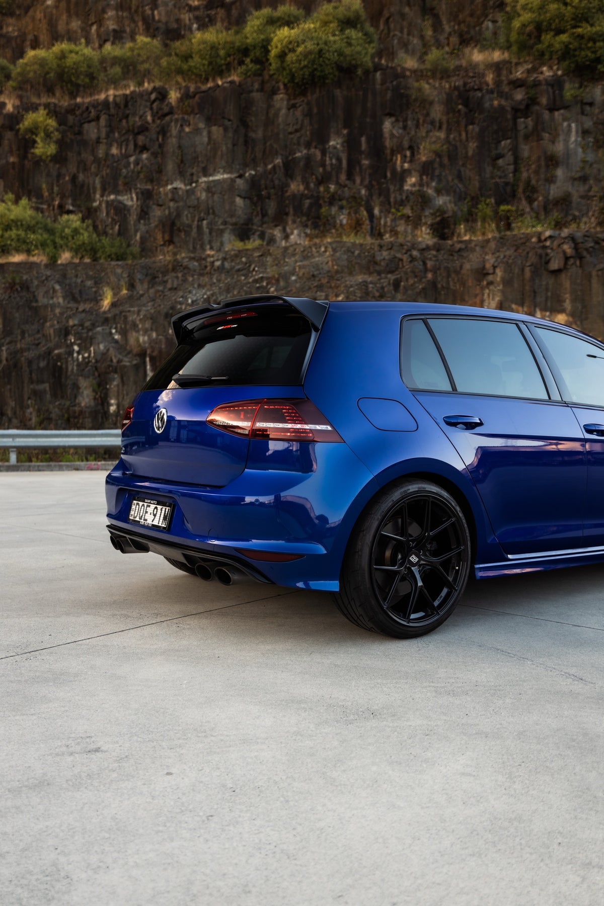 SWF02 forged wheels in Gloss Black on a blue Volkswagen Golf R Mk7, rear three-quarter