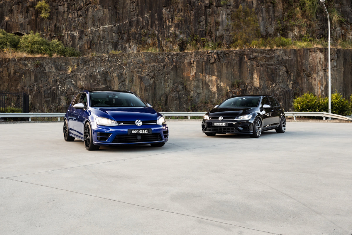 SWF02 forged wheels in Gloss Black on a blue Volkswagen Golf R Mk7, next to the black Mk7.5 Golf R on SWF03