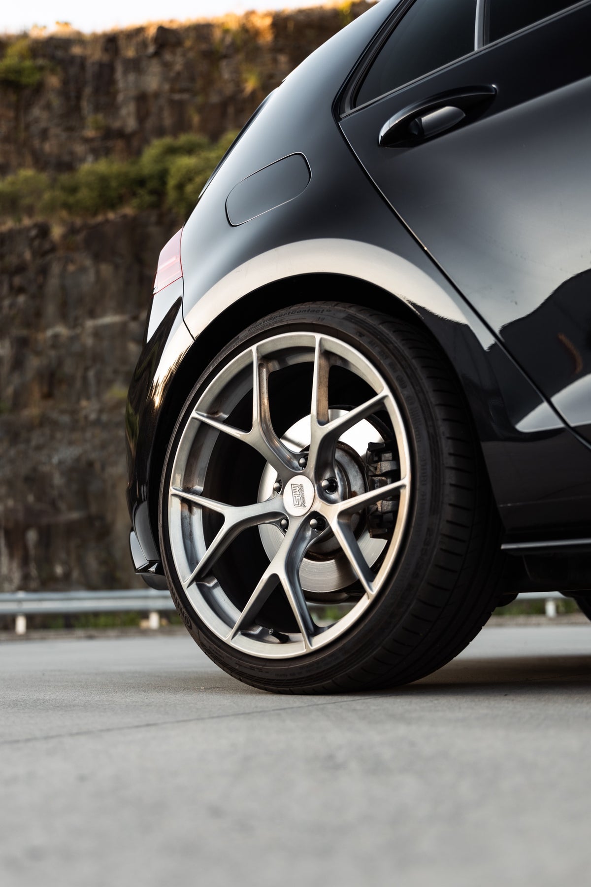 SWF03 forged wheels in Brushed Grey on a black Volkswagen Golf R Mk7.5, front wheel close-up