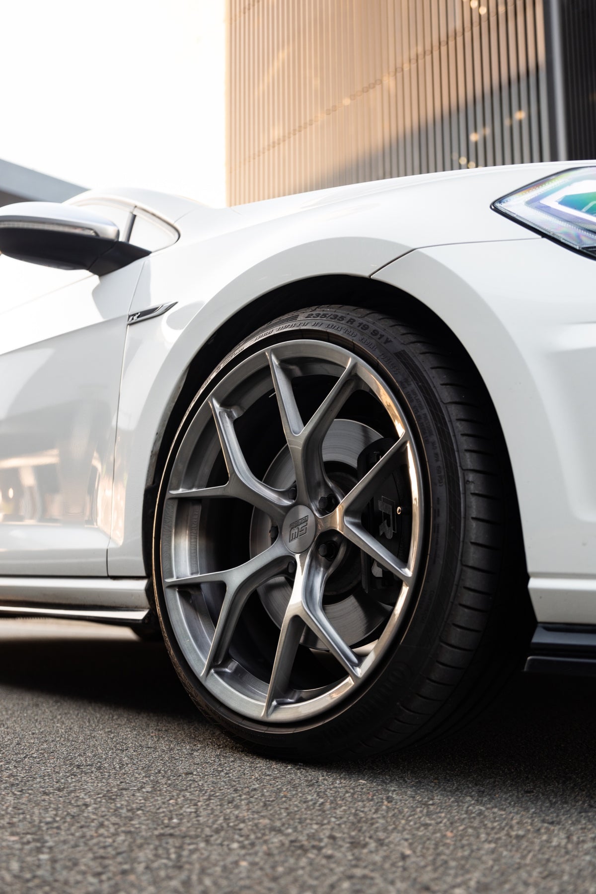 SWF03 forged wheels on a white Volkswagen Golf R Mk7.5 wagon, front wheel close-up