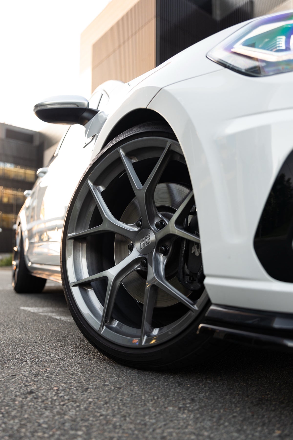 SWF03 forged wheels on a white Volkswagen Golf R Mk7.5 wagon, front wheel, low angle