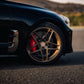SWF04 forged wheels in Satin Bronze on a black Kia Stinger, front wheel close-up