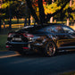 SWF04 forged wheels in Satin Bronze on a black Kia Stinger, rear three-quarter in autumn