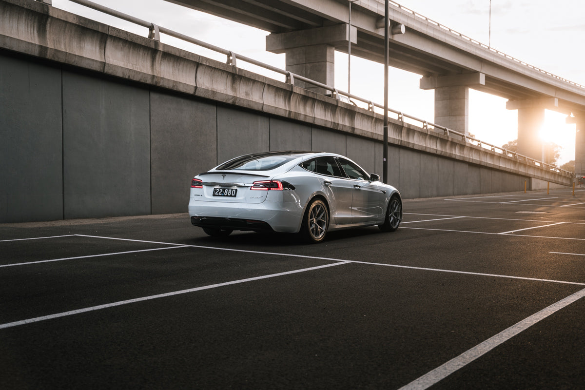 SWF07 forged wheels on a Tesla Model S, rear three-quarter at the overpass