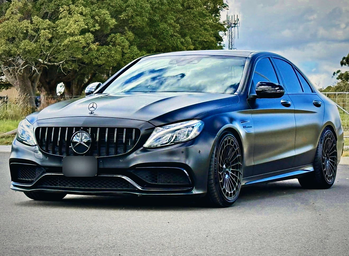 SWF14 forged wheels in Gloss Black on a matte black Mercedes-AMG C63 W205, front three-quarter from the left