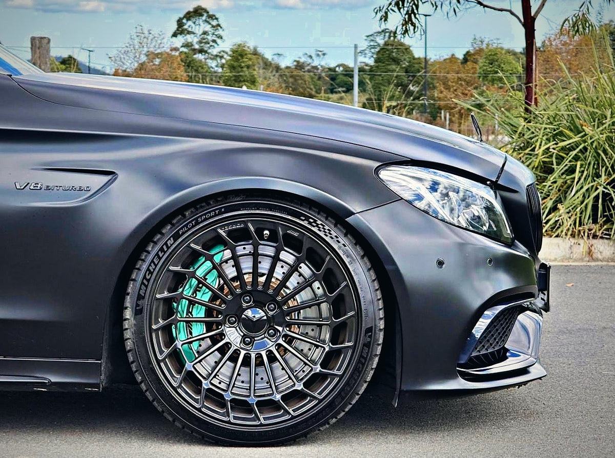 SWF14 forged wheels in Gloss Black on a matte black Mercedes-AMG C63 W205, front wheel and brake detail