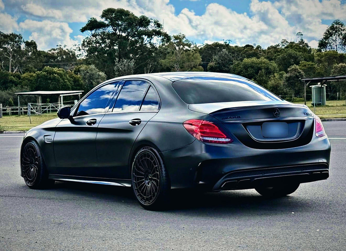 SWF14 forged wheels in Gloss Black on a matte black Mercedes-AMG C63 W205, rear three-quarter